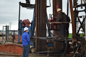 Nathan Conway, CEO of Fortis Energy Services, Inc. talks to the foreman at Rig 1071 near West Hope, North Dakota. The well is operated by Murex Petroleum Corp. Photo: EnerCom Inc.