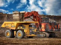 A hydraulic shovel places overburden in a haul truck at the Fort Hills site.

Courtesy of Suncor