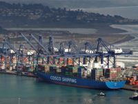 FILE PHOTO: A China Ocean Shipping Company (COSCO) container ship is seen at San Antonio port in Chile August 6, 2019. REUTERS/Rodrigo Garrido/File Photo