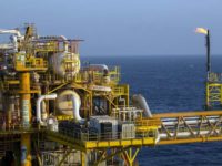 Gas flares from a burner tower, right, on one of the sections of the Petroleos Mexicanos (Pemex) Pol-A Platform complex, located on the continental shelf in the Gulf of Mexico, 70 kilometers offshore from Ciudad del Carmen, Mexico, on Saturday, March 29, 2014.  
Photo: Susana Gonzalez, Bloomberg