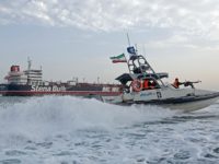 A picture taken on July 21, 2019, shows Iranian Revolutionary Guards patrolling around the British-flagged tanker Stena Impero as it's anchored off the Iranian port city of Bandar Abbas. - Iran warned Sunday that the fate of a UK-flagged tanker it seized in the Gulf depends on an investigation, as Britain said it was considering options in response to the standoff. Authorities impounded the Stena Impero with 23 crew members aboard off the port of Bandar Abbas after the Islamic Revolutionary Guard Corps seized it Friday in the highly sensitive Strait of Hormuz. (Photo by Hasan Shirvani / MIZAN NEWS AGENCY / AFP)        (Photo credit HASAN SHIRVANI/AFP/Getty Images)