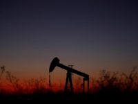 An oil pump is seen just after sunset outside Saint-Fiacre, near Paris, France September 17, 2019. REUTERS/Christian Hartmann