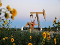 FILE PHOTO: A pump jack operates at a well site leased by Devon Energy Production Company near Guthrie, Oklahoma September 15, 2015. REUTERS/Nick Oxford