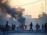 Demonstrators gather at a protest during a curfew, three days after the nationwide anti-government protests turned violent, in Baghdad, Iraq October 4, 2019. REUTERS/Alaa al-Marjani