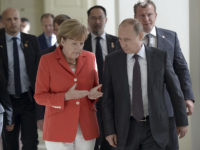 Vladimir Putin and Angela Merkel walk together during a meeting in Rio de Janeiro in 2014. (Imre Toma, https://flic.kr/p/yCehE8; CC BY 3.0, https://creativecommons.org/licenses/by/3.0/)