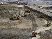 Heavy equipment mover soil on one of the mounds as Rio Tinto Kennecott officials talk about their work to reclaim land after the closer of the Barney’s Canyon gold on Tuesday