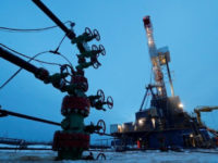 FILE PHOTO: A well head and drilling rig in the Yarakta oilfield, owned by Irkutsk Oil Company (INK), in the Irkutsk region, Russia, March 11, 2019. REUTERS/Vasily Fedosenko/File Photo