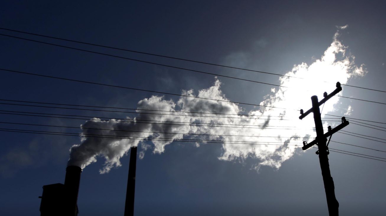 Vapour pours from a steel mill chimney in the industrial town of Port Kembla