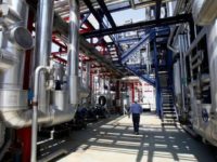 Reuters FILE PHOTO: A worker walks at Enel SpA's hydrogen-fuelled combined cycle power plant inside the Andrea Palladio Fusina plant in Venice July 12, 2010. REUTERS/Alessandro Garofalo