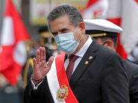 The head of the Peruvian Congress, Manuel Merino, waves after being sworn in as interim President in Lima on November 10, 2020 day after the Congress voted to impeach and oust President Martin Vizcarra over corruption allegations. - Merino, 59, was sworn in at a special session of Congress on Tuesday, becoming Peru's third president since 2016, reflecting the institutional fragility which has characterized the South American country. Under the constitution, he will take over the presidential functions until the end of the current term in July 2021. (Photo by Luka GONZALES / AFP) (Photo by LUKA GONZALES/AFP via Getty Images)