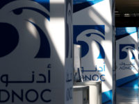 FILE PHOTO: Logos of ADNOC are seen at Gastech, the world's biggest expo for the gas industry, in Chiba, Japan, April 4, 2017.    REUTERS/Toru Hanai